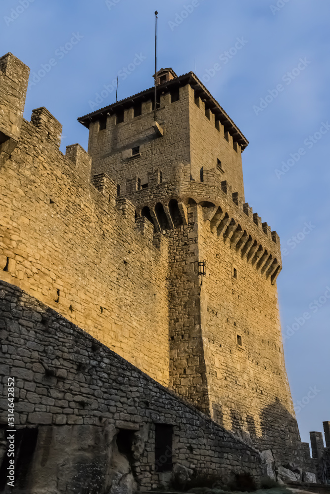 Guaita or Rocca (First tower) with the battlements in San Marino during the sunset - Image