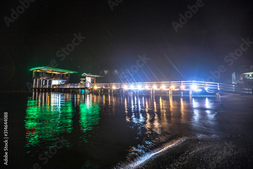 Roatán, Honduras »; January 2020: Lights on a jetty at Sandy Bay beach on Roatán Island