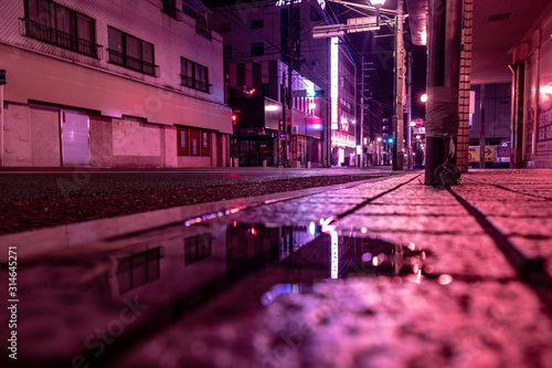 purple street light in the city at night with cyber punk color theme in Asia