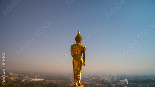 behide the buddha status looking at the city