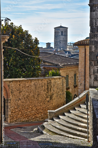 Veroli, Italy, 01/03/2020. A narrow street between the old houses of a medieval village photo