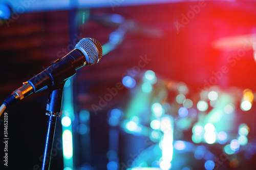 Microphone at concert on red background