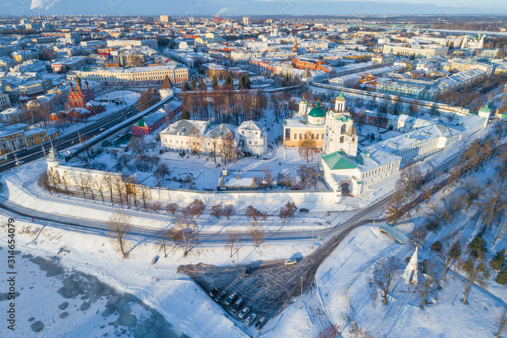 Obraz premium The old Transfiguration Monastery in the cityscape on a sunny January day (aerial photography). Yaroslavl, Golden Ring of Russia