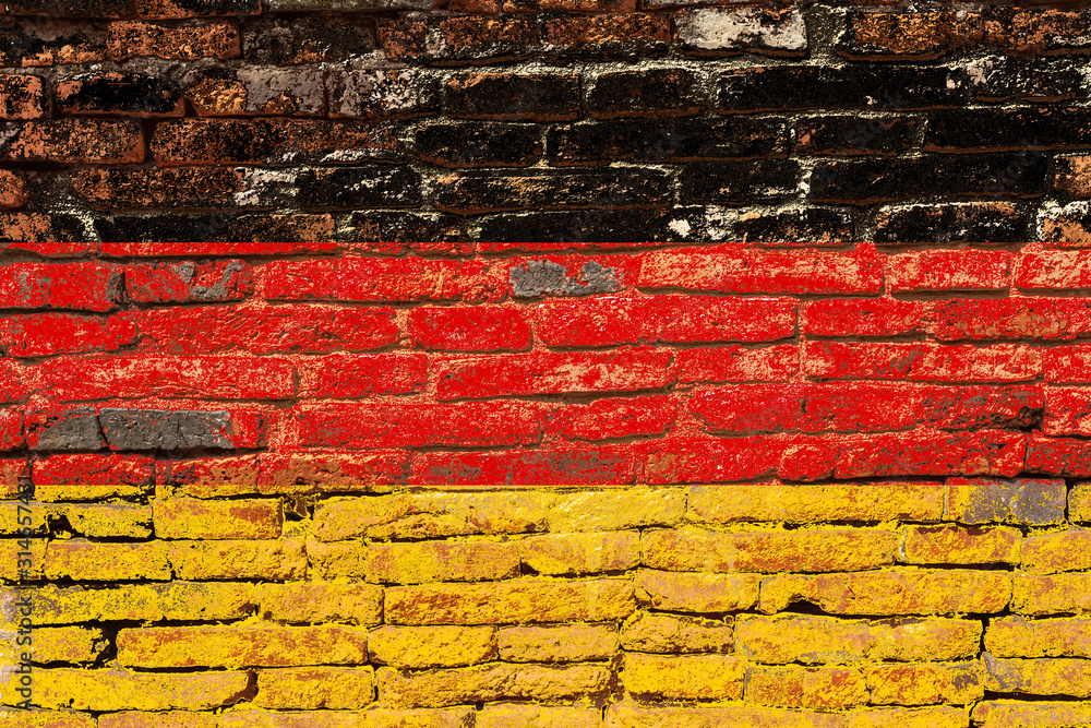 Drapeau allemand sur vieux mur de briques Drapeau allemand sur vieux mur de briques