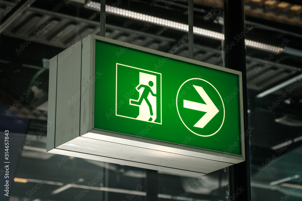 Emergency Exit sign on airport closeup - Emergency Exit sign on airport closeup -