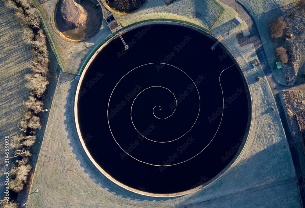Sewage water works treatment plant aerial view from above showing waste quality round circular control tank