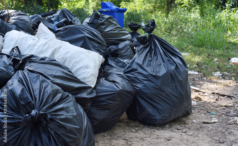 Garbage bags and trash on the street. Pollution concept Garbage bags and trash on the street. Pollution concept