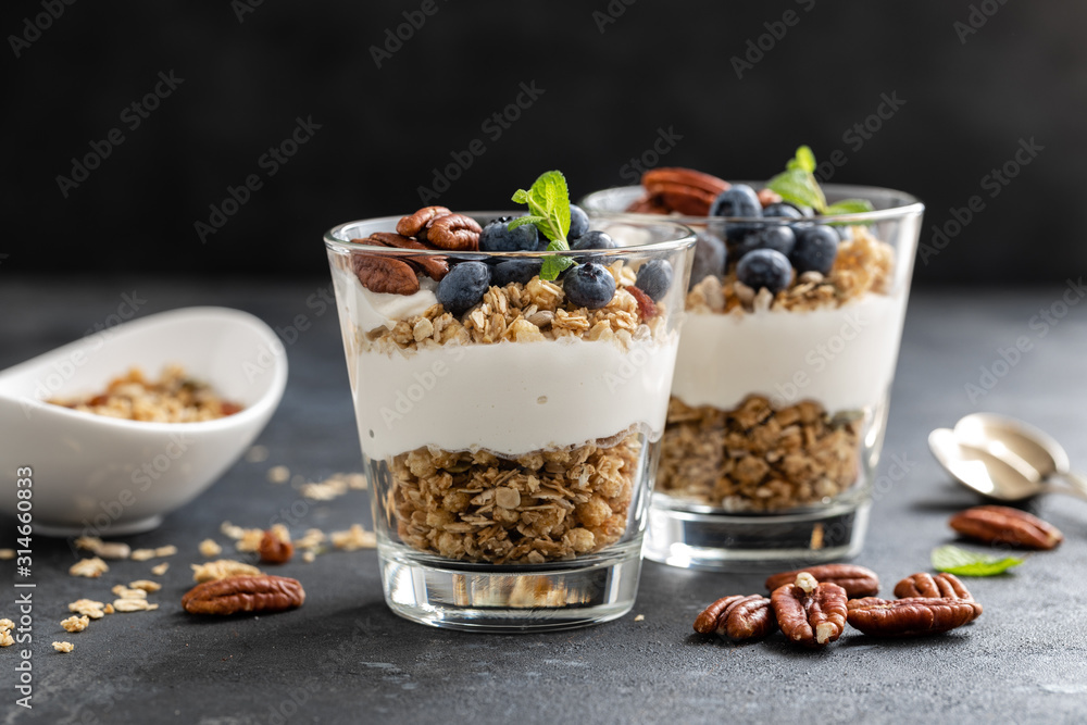 Blueberry parfait with ricotta cheese, granola and pecan nuts Blueberry parfait with ricotta cheese, granola and pecan nuts