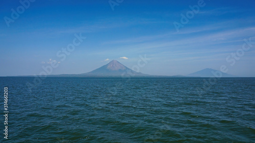 Insel Ometepe in Nikaragua mit zwei Vulkanen Concepción bei blauem Himmel photo