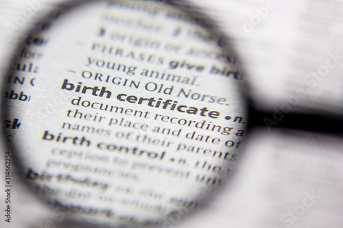 Photos Word or phrase Birth certificate in a dictionary.