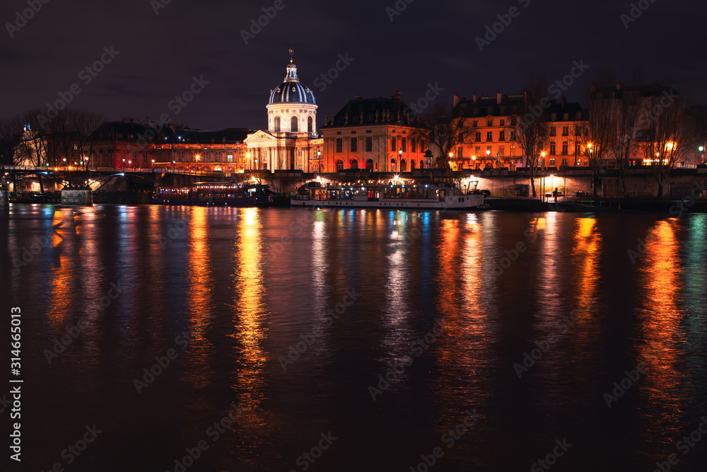Night view of Les Invalides and Seine River in Paris 