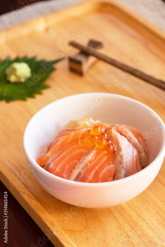 Japanese food salmon ikura don salmon and ikura with rice. Top view on wooden table.