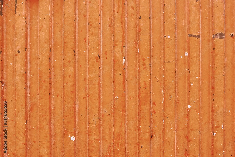 detail of orange metal garage door texture; metal background detail of orange metal garage door texture; metal background