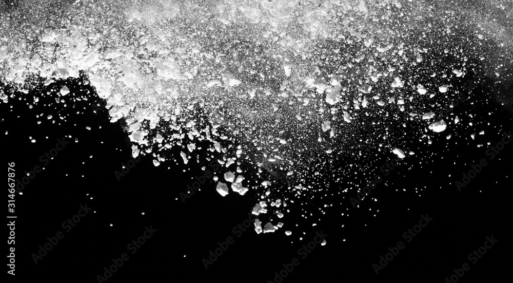 White powder explosion isolated on black background. White powder explosion isolated on black background.