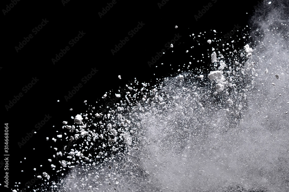 White powder explosion isolated on black background. White powder explosion isolated on black background.