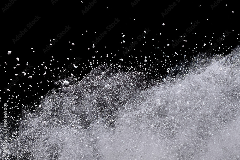White powder explosion isolated on black background. White powder explosion isolated on black background.