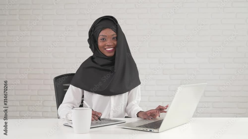 Woman working on digital tablet and laptop. Woman working on digital tablet and laptop.