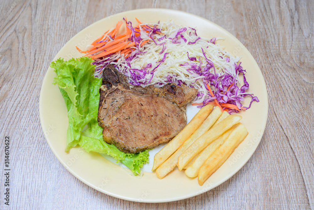 Grilled steak with french fries on the plate Grilled steak with french fries on the plate