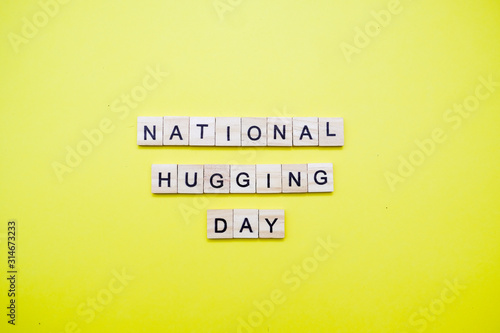 Words on plain background ; National Hugging Day.
