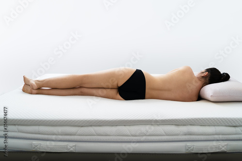 Woman Sleeping On Orthopedic Mattress