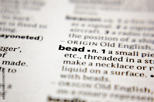 Word or phrase bead in a dictionary.