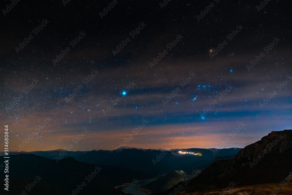 A sky full of stars over the lake