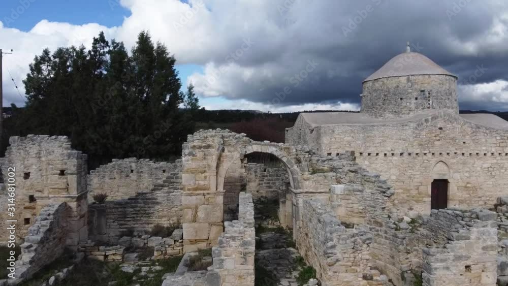 Exploring the Greek ruins of the Monastery of Timios Stavros Anogyra, Cyprus. Drone shot pushing in on the stone building. Exploring the Greek ruins of the Monastery of Timios Stavros Anogyra, Cyprus. Drone shot pushing in on the stone building.