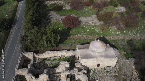 Aerial drone shot looking down over the Monastery of Timios Stavros Anogyra, Cyprus. photo