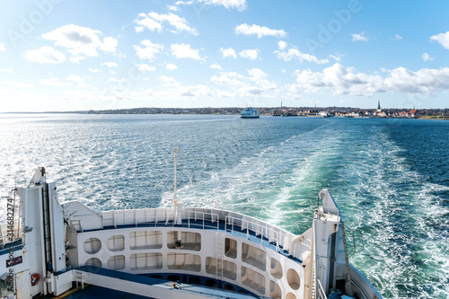 Canvas Print View over board of passenger ferry between Denmark and Sweden over blue sea and waves