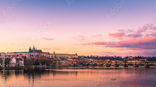 Panoramic View of Prague gothic Castle with Charles Bridge after Sunset, Czech Republic