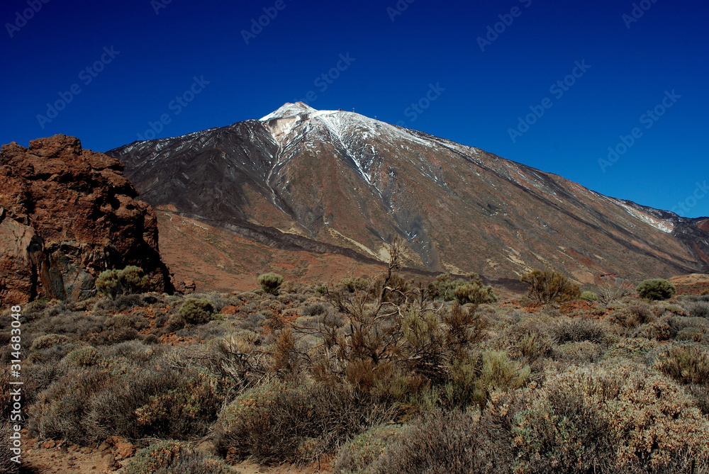 Teide volcano with some snow and rocks located at Teide National Park, Tenerife, Canary Islands
