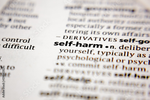 Word or phrase self-harm in a dictionary.