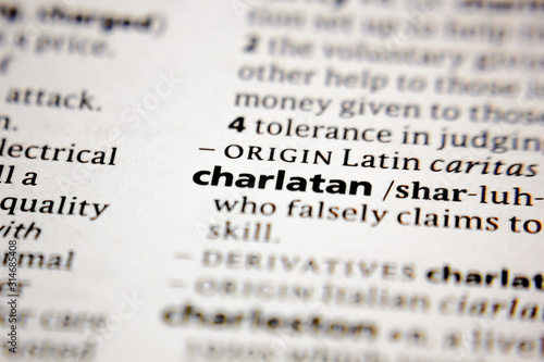 Word or phrase charlatan in a dictionary. photo