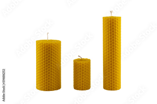 Beeswax candles isolated on white background. Handmade, decorative and healthy candles. Natural aromatic beeswax candle.
