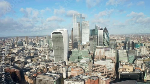 London city centre aerial panorama view: financial district, Thames river, Belfast, skyscrappers, warf and buildings and St. Pauls Cathedral, Tower Bridge and The Tower