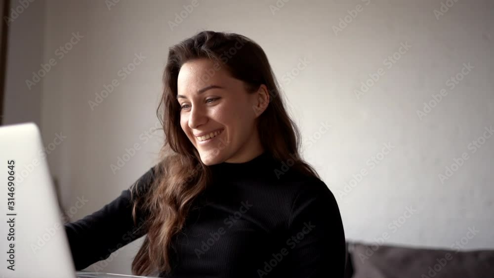 young woman typing on a laptop young woman typing on a laptop