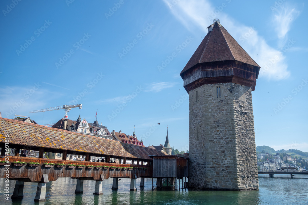 Beautiful scene of famous stone tower at Chapel bridge on blue sky for backgrond with copy space, Lucerne, Switzerland