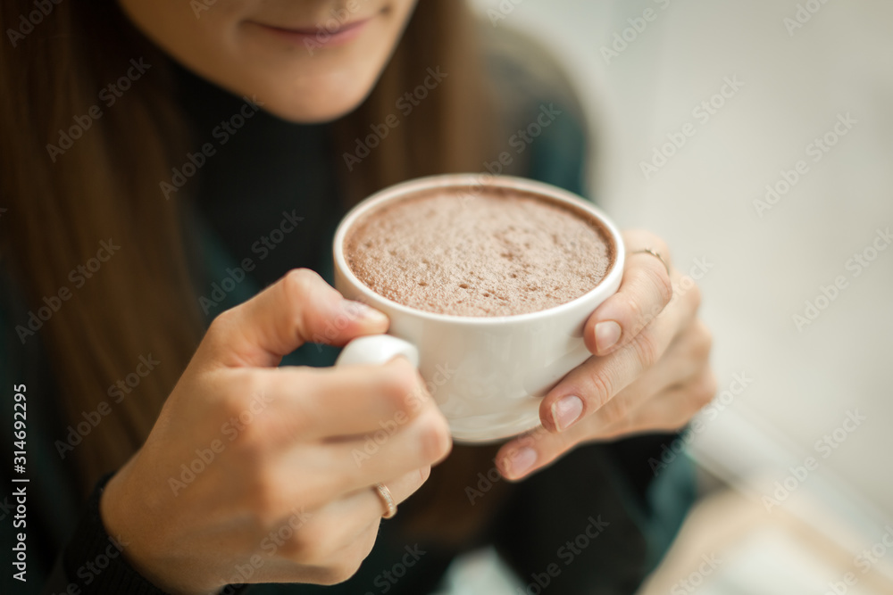 young girl on a date at breakfast with a cup of cocoa young girl on a date at breakfast with a cup of cocoa