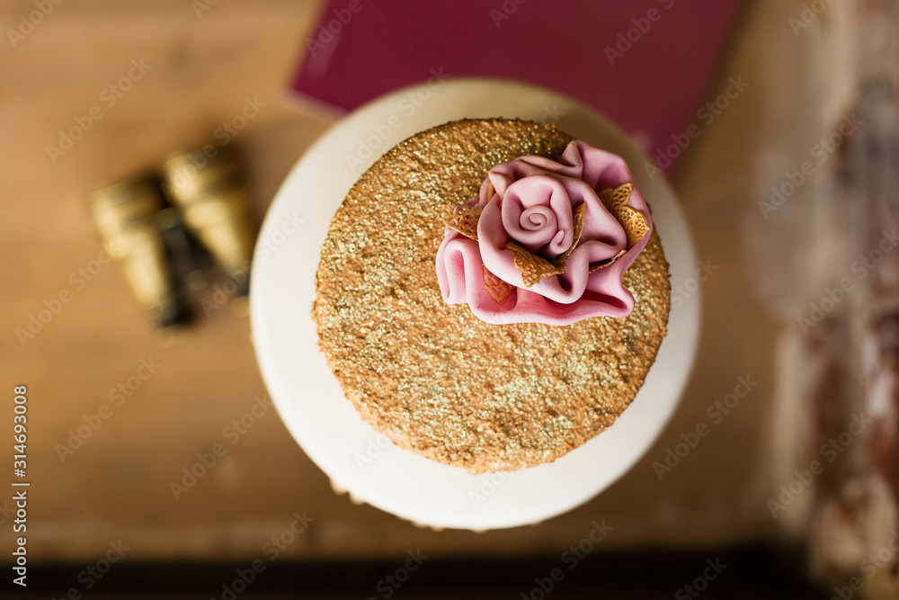 An example of three beautiful wedding cakes from a pastry chef. Elegant and unusual design with edible gold and sugar flowers. An example of three beautiful wedding cakes from a pastry chef. Elegant and unusual design with edible gold and sugar flowers.
