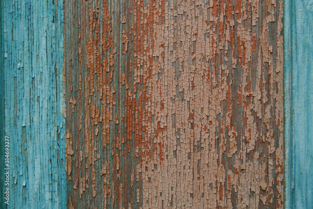 background texture of old natural wooden boards with old multicolor paint with scuffs. Vintage background, pattern, banner. turquoise blue and brown red colors