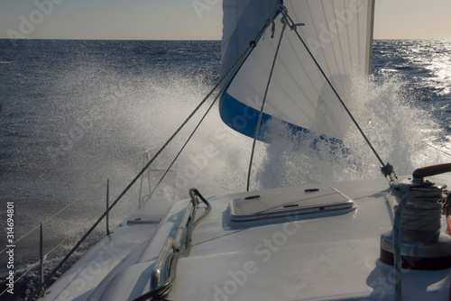 Sailing in strong winds and stormy seas. photo