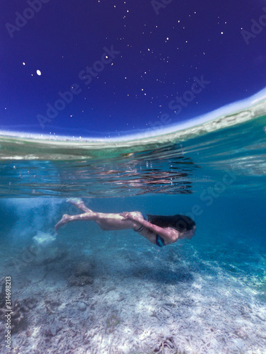 swimming underwater at night