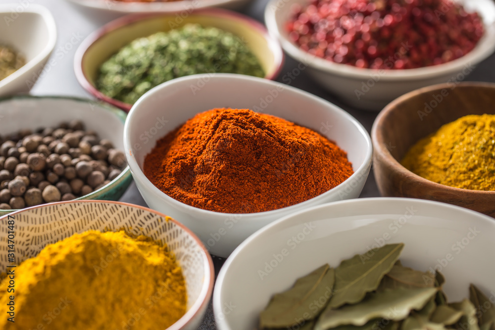 Set of variety aromatic spices and herbs in bowls Set of variety aromatic spices and herbs in bowls