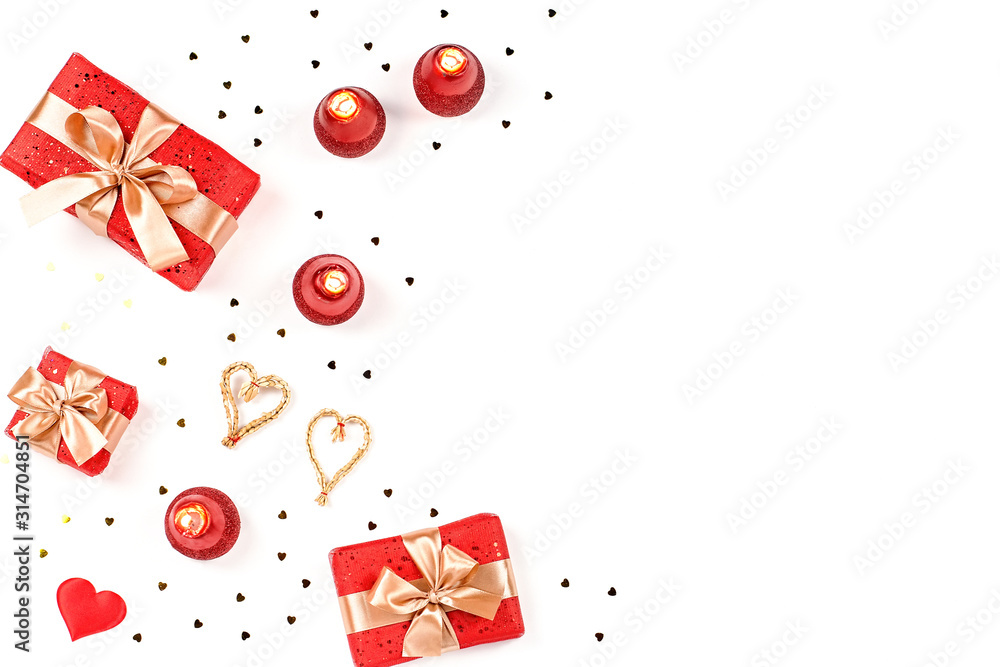 Creative Valentine's Day greeting card with red decorations and gift boxes, golden heart confetti on white background, copy space, top view - obrazy, fototapety, plakaty 