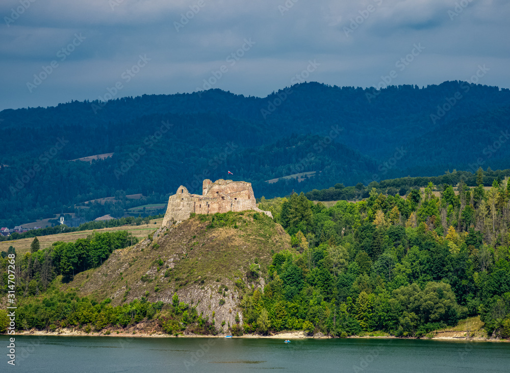 Fototapeta premium View over Lake Czorsztyn towards Czorsztyn Castle, Lesser Poland Voivodeship, Poland
