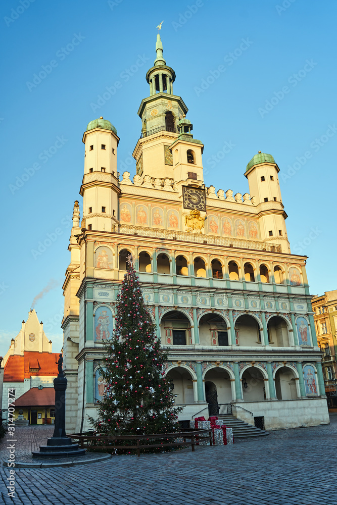 The facade of the historic Renaissance town hall and Christmas tree in Poznan.