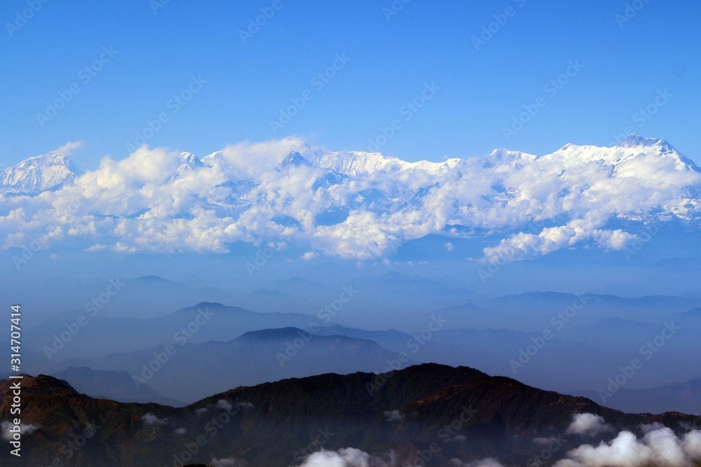 The Himalayas in the coulds / Enormous of the Himalaya ranges above the cloud and layer of dust over Nepal