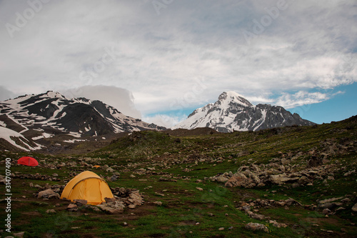 Small camp with tents among the hills