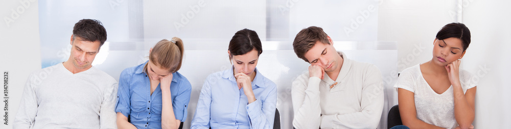 Obraz premium Group Of People Sleeping On Chair