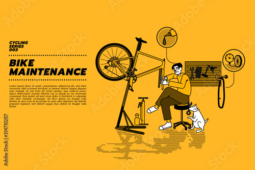 Handsome Asian bike mechanic repairs bicycle in his workshop with his dog